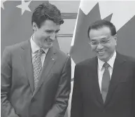  ?? FRED DUFOUR / AFP / GETTY IMAGES ?? Prime Minister Justin Trudeau and China’s Premier Li Keqiang attend a signing ceremony at the Great Hall of the People in Beijing in early December.