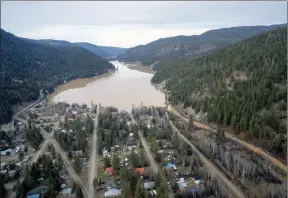  ?? ?? The Canadian Press
A swollen Otter Lake is pictured in Tulameen. Officials in British Columbia are urging residents of communitie­s at elevated risk of flooding to be prepared if water levels rise due to rapidly melting snow following too much rain.