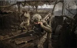  ?? TYLER HICKS — THE NEW YORK TIMES ?? Ukrainian solders fire a Soviet-era howitzer at Russian targets near Avdiivka, Ukraine, on Feb. 14. The war has been raging for more than two years.
