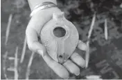  ?? ?? A clay oil lamp from the Islamic period is displayed at site of a Jewish ritual bath near the Western Wall.