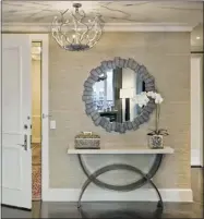  ?? ESTO PHOTOGRAPH­ICS ?? Three circular pieces create an entrance that is cohesive and calming. Uncluttere­d is the way to go for a small space.