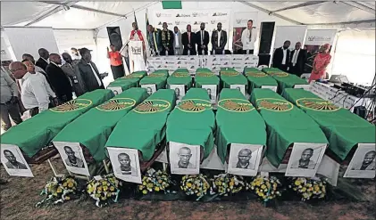  ?? PHOTO: LULAMILE FENI ?? The remains of 14 Poqo combatants who were hanged in 1963 were officially handed over to their families by a government delegation led by Justice Minister Michael Masutha at a ceremony in Mphuthi village outside Mthatha in Eastern Cape on Saturday.