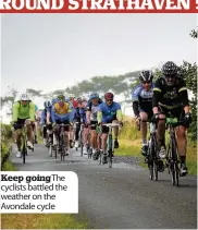  ??  ?? Keep goingthe cyclists battled the weather on the Avondale cycle