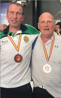  ??  ?? Kieran Murray from Ramelton and Garry Campbell after winning bronze and gold respective­ly in Golf.