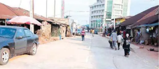  ??  ?? The fairly deserted street after the robbery attack