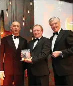  ??  ?? Gary Salter receiving his Award for Engineerin­g Excellence from Kieran Walsh, Office of Public Works and host Pat Kenny