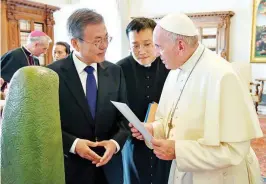  ??  ?? POSSIBLE VISIT – South Korean President Moon Jae-in (left) talks with Pope Francis during a private audience at the Vatican, October 18. The South Korean president is in Italy for a series of meetings that culminated with Pope Francis at which he was expected to extend an invitation from North Korean leader Kim Jong Un to visit. (AP)