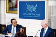  ?? ANDREW HARNIK/AP ?? Consumer Financial Protection Bureau director Rohit Chopra (left), with President Joe Biden, talks about the economy recently. Medical debt has fallen for several reasons, including pandemic relief money and more people signing up for insurance.