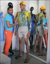  ??  ?? House of St Luke designer Mxolisi Mkhize will showcase his clothes at SA fashion week. He is pictured with model Sethu Khumalo. SIPHELELE BUTHELEZI