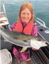  ??  ?? Lola Weir lands the only kingfish in the junior competitio­n. PHOTOS: Supplied.