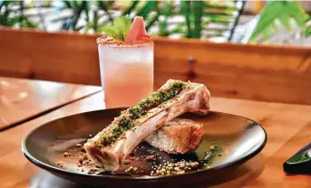  ?? Photos by Alex Montoya ?? Bone marrow with guajillo chile marmalade is on offer at Casa Nomad, a Tulum,-inspired lounge and coastal Mexican restaurant at M-K-T Heights, 600 N. Shepherd.