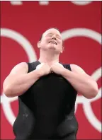  ??  ?? The Associated Press
Laurel Hubbard of New Zealand bows after a lift in a women’s weightlift­ing event at the 2020 Summer Olympics, Monday, in Tokyo.