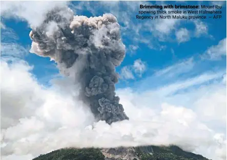  ?? ?? Brimming with brimstone: Mount ibu spewing thick smoke in West Halmahera regency in North Maluku province. — AFP