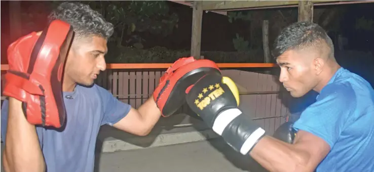  ?? Photo: Waisea Nasokia ?? Junior Wahid Khan (left) with boxer Jim Nalawa during training at the King Khan Boxing Club in Tomuka, Lautoka.