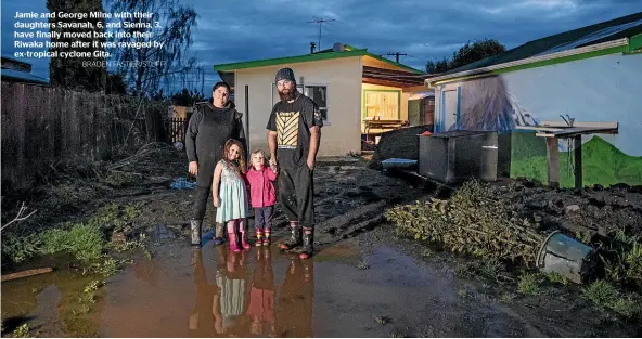  ?? BRADEN FASTIER/STUFF ?? Jamie and George Milne with their daughters Savanah, 6, and Sienna, 3, have finally moved back into their Riwaka home after it was ravaged by ex-tropical cyclone Gita.