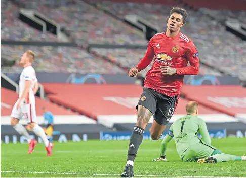  ??  ?? ON FIRE: Hat-trick hero Marcus Rashford turns away after scoring the first of his goals after coming off the bench.