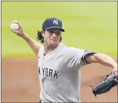  ?? JOHN BAZEMORE — THE ASSOCIATED PRESS ?? Yankees starter Gerrit Cole works in the second inning of Game 1 of a doublehead­er on Wednesday in Atlanta.