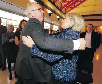  ?? JIM WELLS ?? Newly named University of Calgary president Ed McCauley hugs outgoing president Elizabeth Cannon following the announceme­nt on Thursday. McCauley is currently the university’s vice-president (research).