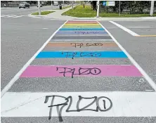  ?? JULIA LOVETTSQUI­RES METROLAND ?? A recently painted rainbow crosswalk incorporat­ing the Pride and trans flag colours has been vandalized.