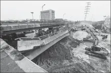  ?? LI BO / XINHUA ?? Rescue team works at the site of an overpass collapse in Wuxi, Jiangsu province, on Friday. Three people have been confirmed dead and two others injured.