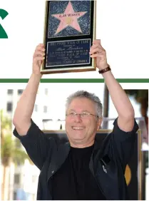  ??  ?? SELECT COMPANY: Alan Menken poses after being honored with a Star on the Hollywood Walk of Fame in Hollywood, California, in this Nov. 10, 2010 picture. (AFP)
