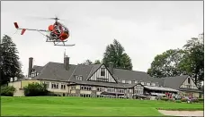  ?? MEDIANEWS GROUP FILE PHOTO ?? Rolling Green Golf Club in Springfiel­d, shown during the traditiona­l helicopter ball drop in 2018, will be allowed to reopen at week’s end thanks to a lifting of restrictio­ns by Gov. Tom Wolf Monday.
