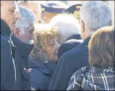  ?? PAOLO GIANDOTTI / ITALIAN PRESIDENTI­AL PRESS SERVICE ?? Giovanna Di Lorenzo, mother of Italian victim Fabrizia Di Lorenzo, is hugged by Italian President Sergio Mattarella upon her arrival from Berlin on a plane carrying the casket of their daughter, at Rome’s military airport of Ciampino on Saturday.