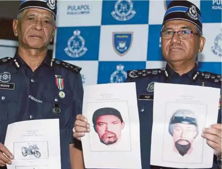  ?? PIC SALHANI IBRAHIM ?? Inspector-General of Police Tan Sri Mohamad Fuzi Harun (right) dan and his deputy, Tan Sri Noor Rashid Ibrahim, with the photofits of the suspects.