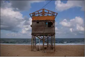  ?? (AP/Khalil Hamra) ?? A wooden lifeguard station is seen Sept. 27 on the beach of Gaza City.