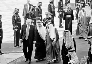  ?? REUTERS ?? Saudi Arabia’s King Salman bin Abdulaziz Al Saud (third from left) welcomes US President Donald Trump and first lady Melania Trump at the King Khalid Internatio­nal Airport in Riyadh on Saturday