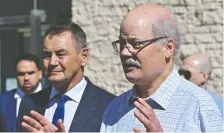  ?? ED KAISER ?? Lawyer Richard Mirasty looks on as Tom Engel, chairman of the Alberta Criminal Trial Lawyers’ Associatio­n policing committee, demands policing reforms during a news conference in Edmonton Friday.