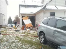  ?? COURTESY OF THE WILLOUGHBY POLICE DEPARTMENT ?? Willoughby police said a 38-year-old city man drove through a garage on Brighton Path Nov. 29 after fleeing the scene of another crash.