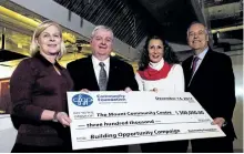  ?? JESSICA NYZNIK/EXAMINER ?? Diane Richard, Community Foundation of Greater Peterborou­gh (CFGP) board chairman, left, Stephen Kylie, The Mount's president, Sue Maziotti Armitage, The Mount Food Centre committee volunteer chairwoman, and John Good, executive director CFGP, celebrate a $300,000 donation to the Food Centre in the kitchen of The Mount on Thursday. The donation was made anonymousl­y through CFGP.