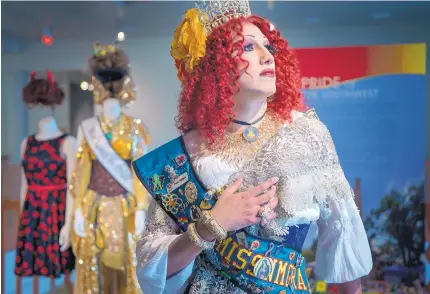  ?? EDDIE MOORE/JOURNAL ?? Paul Valdez, aka Marie Antoinette du Barry and a former Miss Santa Fe Pride, poses with some of his dresses that are included in the Pride of the Southwest exhibit at the New Mexico History Museum, part of this year’s Pride events.