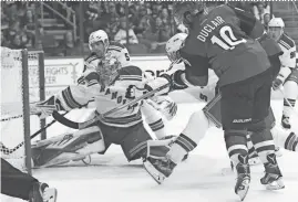  ?? PATRICK BREEN/AZCENTRAL SPORTS ?? The Coyotes' Anthony Duclair shoots on Rangers goalie Antti Raanta on Nov. 7, 2015. Raanta joins the Coyotes after being acquired in a trade on Friday.