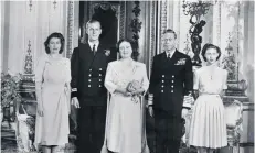  ??  ?? Princess Elizabeth, Philip Mountbatte­n, Queen Elizabeth, King George VI and Princess Margaret at Buckingham Palace on July 9, 1947