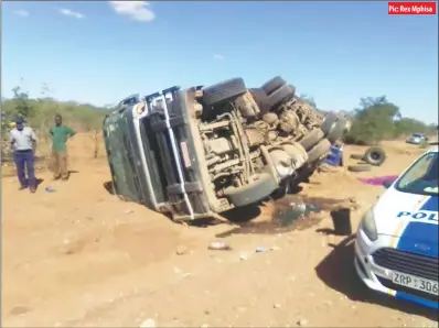  ?? Pic: Rex Mphisa ?? One person died on the spot while the driver survived when this truck, belonging to Mega Market, overturned near the Tshapfuce tollgate in Beitbridge recently. Witnesses said the driver tried to avoid a seemingly mentally-challenged man who was jaywalking on the road.