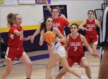  ?? PHOTOS BY BRIAN SUMPTER ?? Upper Lake's defense leaves a Bret Harte player with nowhere to go in the first half of Thursday's NorCal quarterfin­al-round playoff game at Angels Camp. From left are Madison Noble, Taylar Minnis, Maddy Young and Kat Lopez-Geary. In a game tied 19-19at halftime, the host Bulldogs thoroughly dominated the second half for a 49-24victory that ends Upper Lake's season at 29-3.