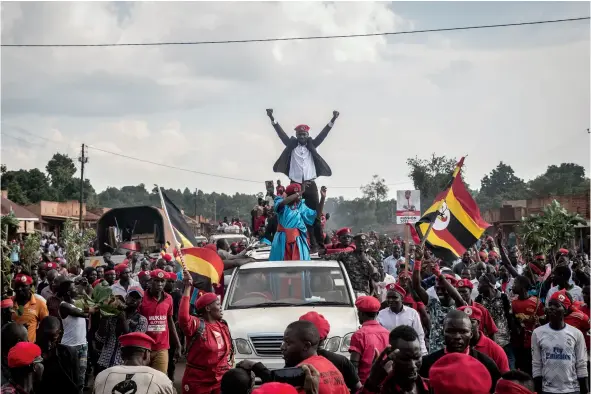  ??  ?? Wine in Hoima, in western Uganda, last year. “[The government] is so scared of my interactio­n with the people,” he says.