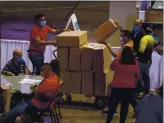  ?? ERIKA P. RODRIGUEZ — THE NEW YORK TIMES ?? Nearly 200boxes of ballots have surfaced in Puerto Rico. Above, vote counting takes place on Wednesday.