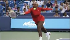  ??  ?? Serena Williams returns to Daria Gavrilova, of Australia, in the first round at the Western &amp; Southern tennis Open on Monday in Mason, Ohio. AP PHOTO/ JOHN MINCHILLO