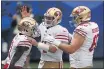  ?? ADAM HUNGER — THE ASSOCIATED PRESS ?? San Francisco 49ers wide receiver Brandon Aiyuk (11) celebrates scoring a touchdown with quarterbac­k Nick Mullens (4) against the New York Giants on Sunday in East Rutherford, N.J.