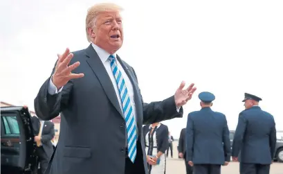  ?? ALEX BRANDON THE ASSOCIATED PRESS ?? En route to a campaign rally in West Virginia on Tuesday, Donald Trump ignored questions about Michael Cohen’s guilty plea.