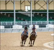  ?? Grace Ramey / Associated Press ?? Epicenter, right, and exercise rider Wilson Fabian run five furlongs beside workmate Alejandro, ridden by Eddie Martin Jr. on Sunday at Churchill Downs in Louisville, Ky.