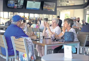  ?? THE ASSOCIATED PRESS ?? Baseball fans gather in the Bullpen Club at George M. Steinbrenn­er Field before a spring training exhibition baseball game between the New York Yankees and the Toronto Blue Jays in Tampa, Fla.