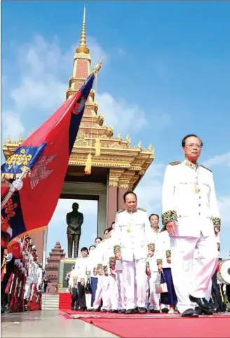  ?? HENG CHIVOAN ?? Minister of Posts and Telecommun­ications Tram Iv Tek (front right) leads a procession at a ceremony marking the 7th anniversar­y of the death of King Father Norodom Sihanouk.