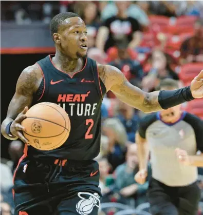  ?? JOHN MCCALL/SOUTH FLORIDA SUN SENTINEL HEAT NOTES ?? Heat guard Terry Rozier gestures during his game against the Celtics during the first half Feb. 11 at Kaseya Center in Miami.