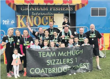  ??  ?? Finishing line Arthur McHugh’s family team and their friends from Bannan Fitness raised a combined £2300