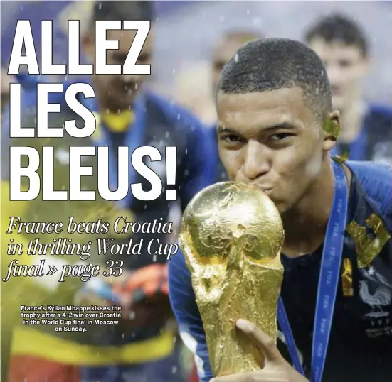  ?? THE ASSOCIATED PRESS ?? France’s Kylian Mbappe kisses the trophy after a 4-2 win over Croatia in the World Cup final in Moscow on Sunday.