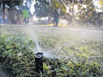  ?? Mark Boster Los Angeles Times ?? UNDER GROWING PRESSURE from the state board, agencies across California have stepped up conservati­on enforcemen­t, including fines and outdoor watering limits, and have raised water rates to slash use.